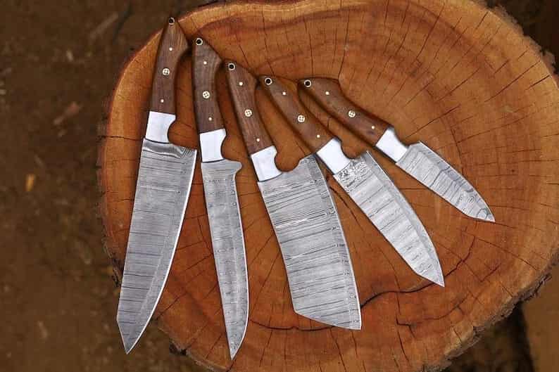 Multi-rivet details on natural wood chef knife handles