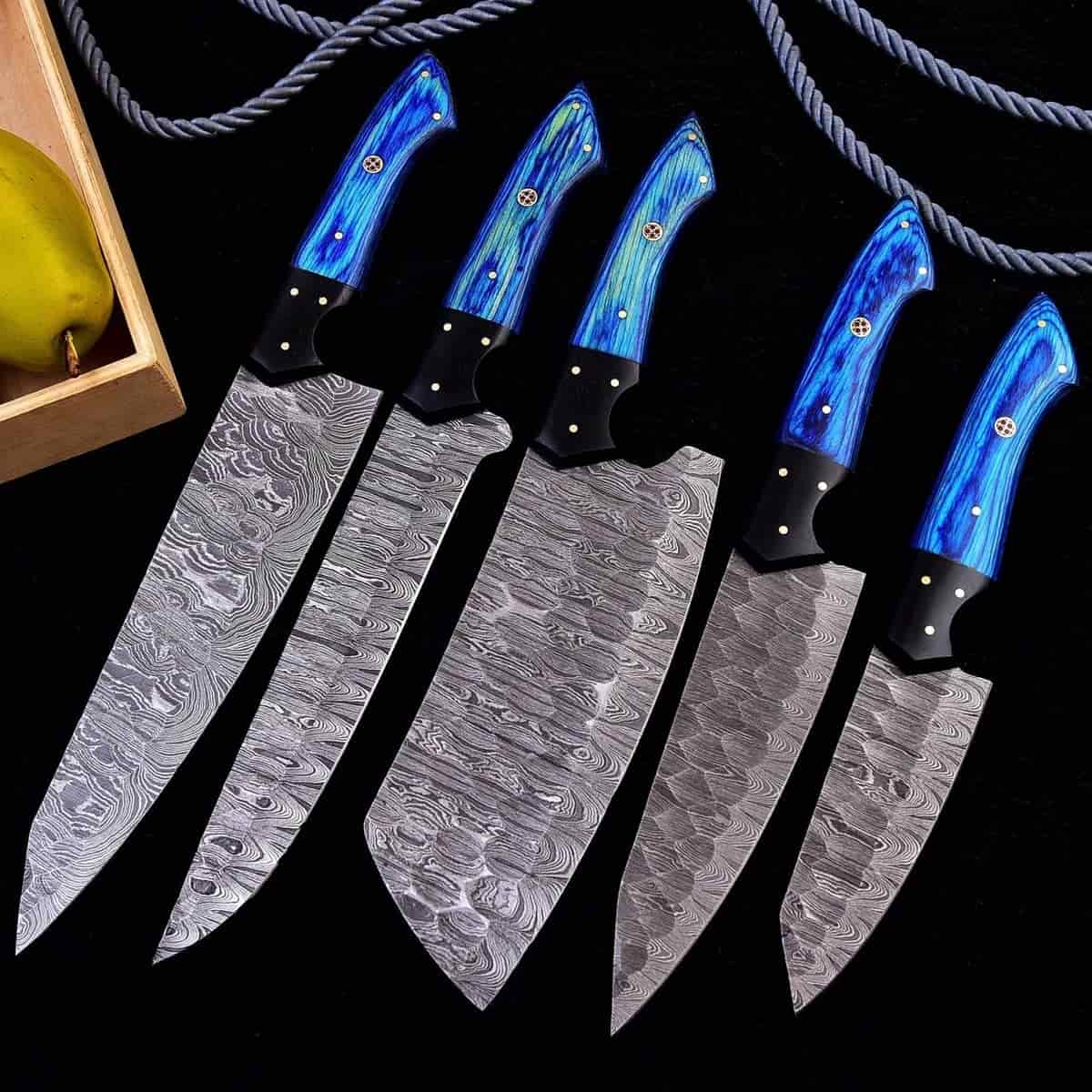 Blue-stained wood handles and Damascus blade patterns