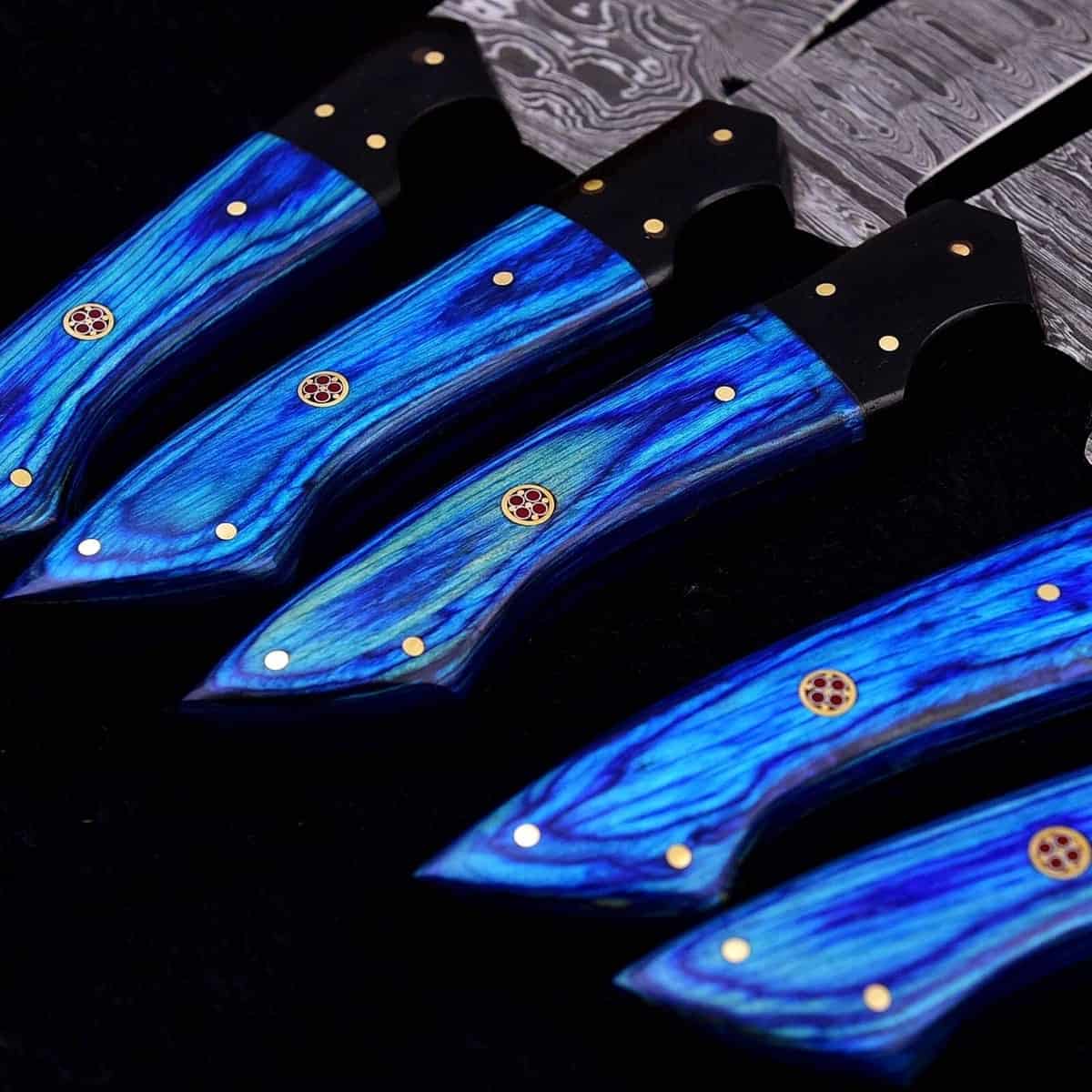 Mosaic pin details on blue wood chef knife handles