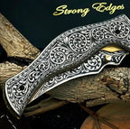 8-inch handmade carbon steel folding knife with engraved metal handle and leather sheath – view 2