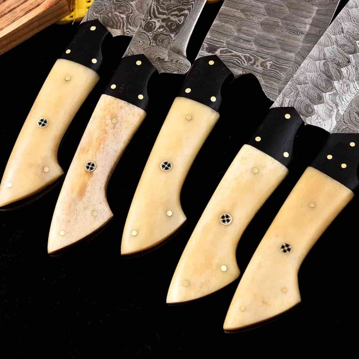 Cream-tone handles and patterned Damascus blades