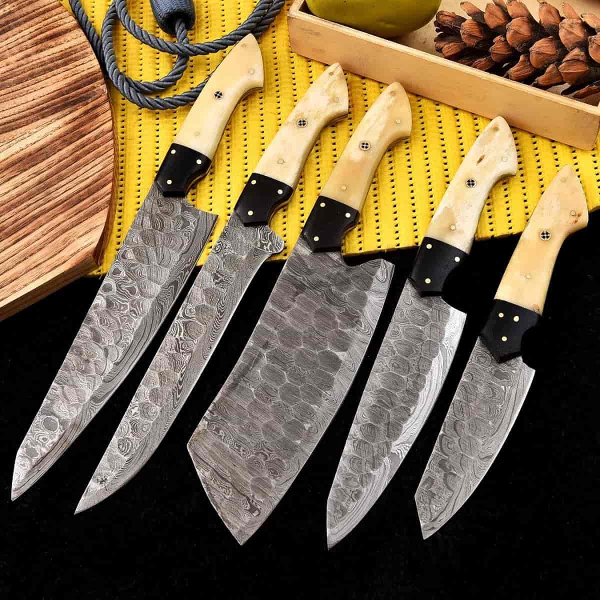 Mosaic pin details on cream chef knife handles