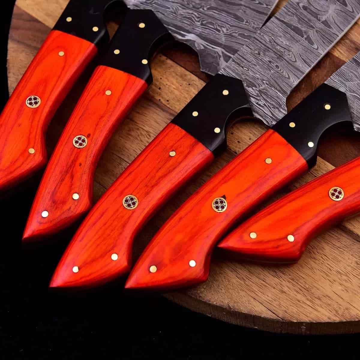 Mosaic pin details on ember-tone chef knife handles