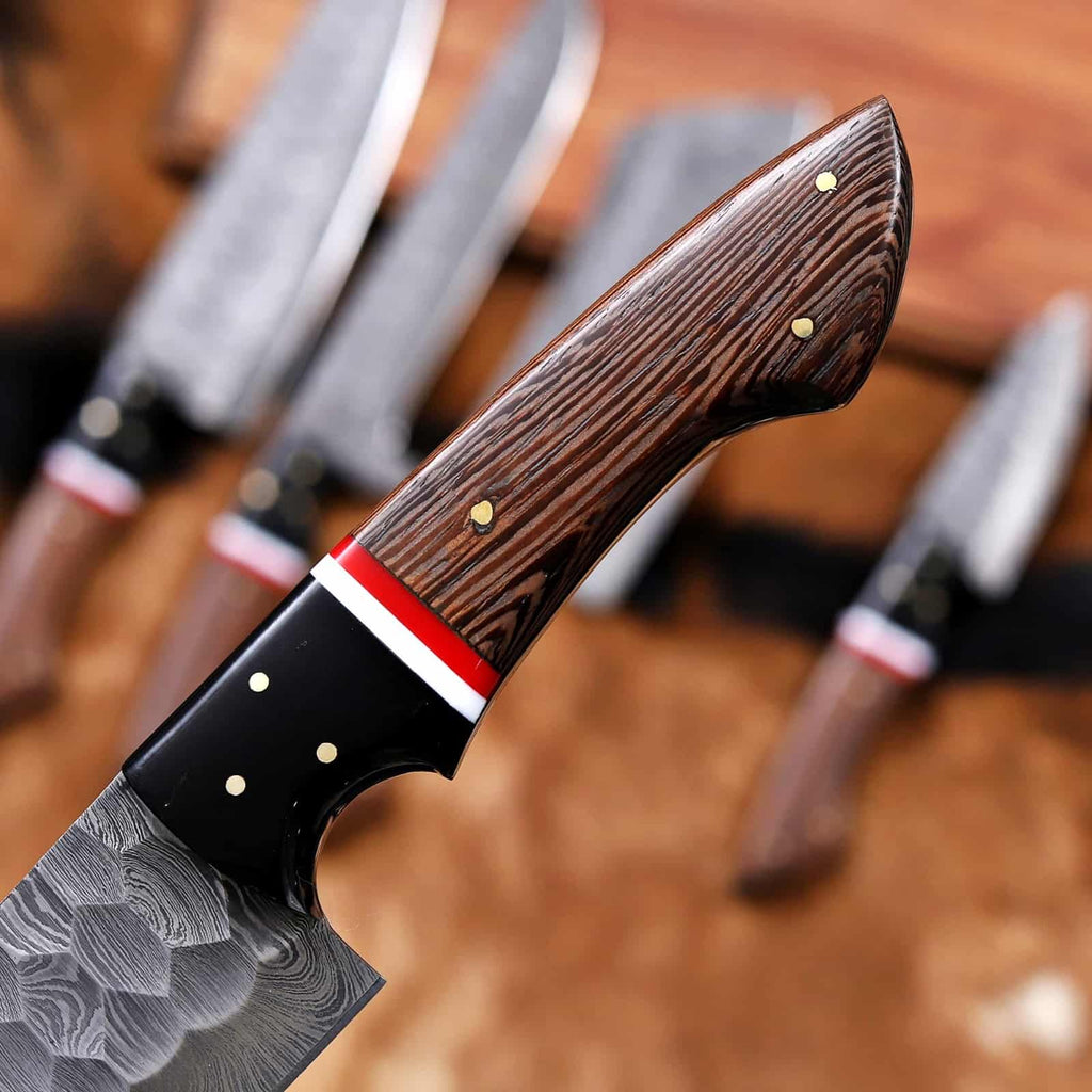 Hammered Damascus blade texture and dark wood handles