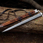 hand-forged Damascus Viking longsword with detailed handle and wooden scabbard – view 1