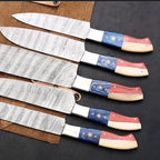 Handmade Damascus kitchen knives arranged as a four-piece set