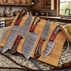Damascus blade patterns with dark wood and red handle accents