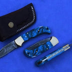6.5-inch handmade twist Damascus folding knife with coloured wood handle and sheath – view 1