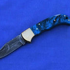 6.5-inch handmade twist Damascus folding knife with coloured wood handle and sheath – view 5